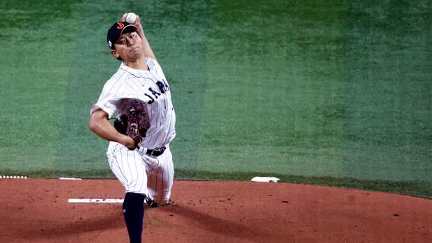Mar 21, 2023; Miami, Florida, USA; Japan starting pitcher Shota Imanaga (21) pitches against the USA in the first inning at LoanDepot Park. Mandatory Credit: Rhona Wise-USA TODAY Sports